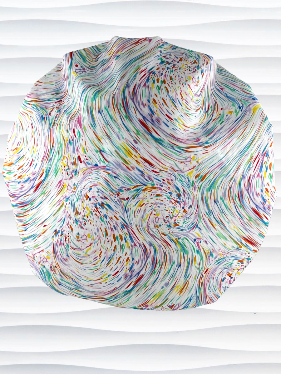 Bouffant style surgical scrub cap hat with pastel oil slick swirls all over this white cotton fabric.