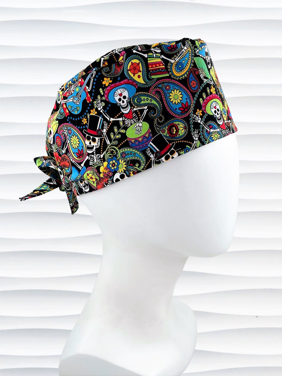 Surgeon style scrub cap hat with day of the dead characters on black cotton fabric