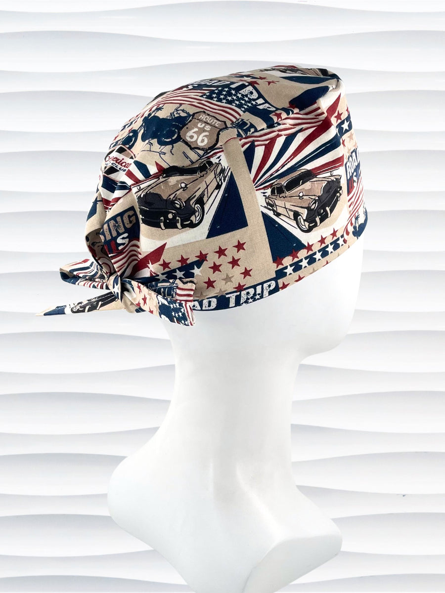 Surgeon style surgical scrub cap hat with classic cars and morotcycles and american flags in red, blue, and white on cotton fabric.