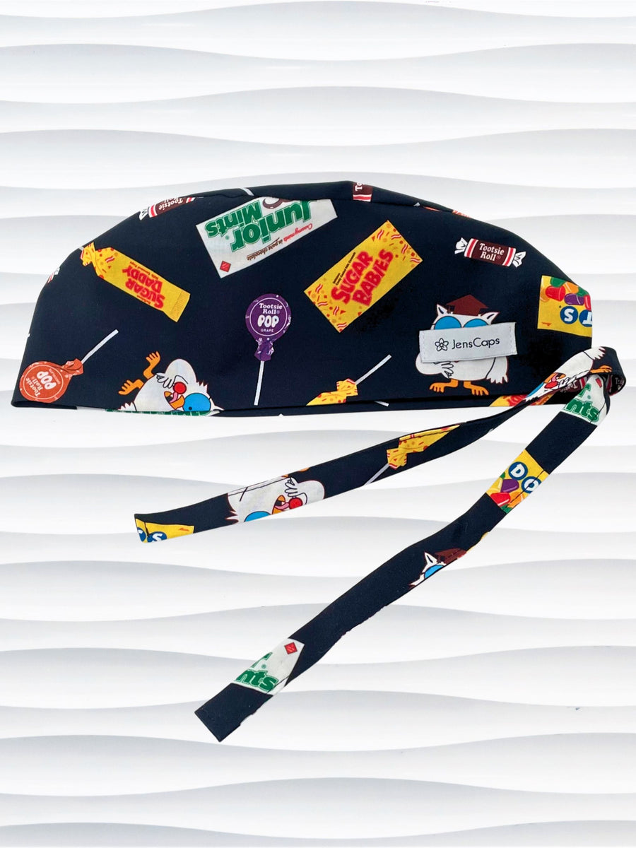 Surgeon style surgical scrub cap hat with iconic candies and Mr Owl on black cotton fabric.