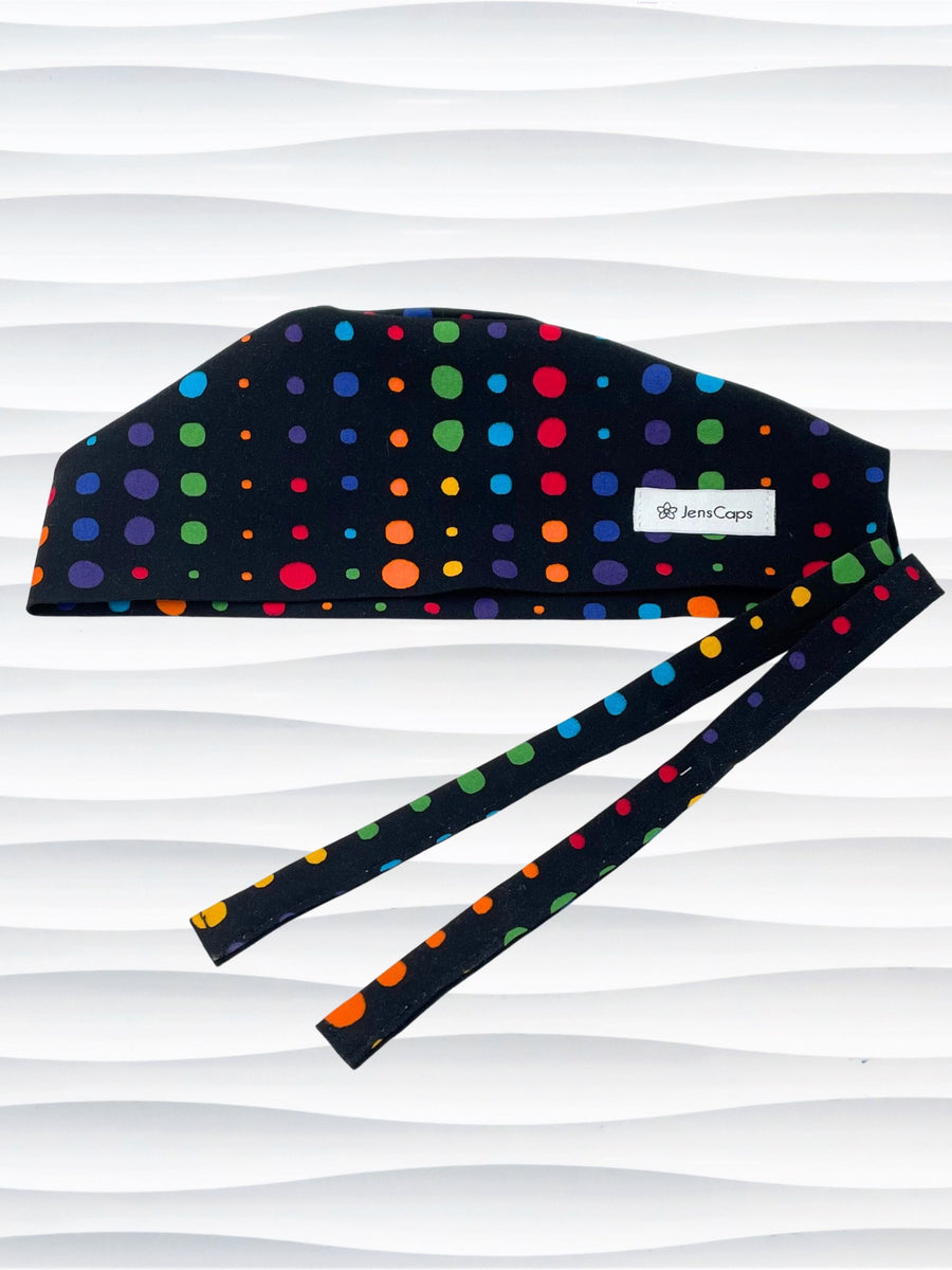 Surgeon style surgical scrub cap hat with bright colored linear dots on black cotton fabric.