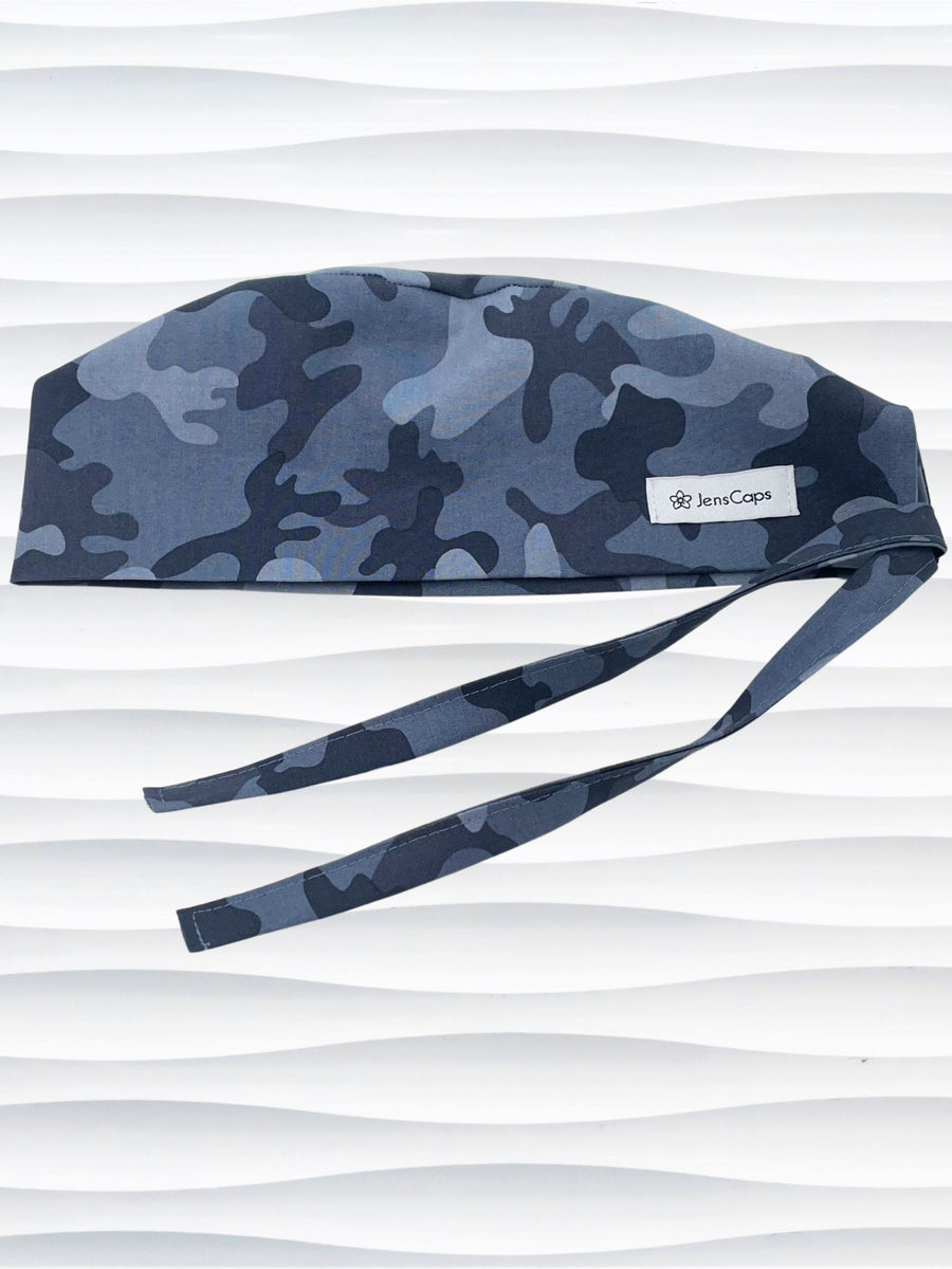 Surgeon style surgical scrub cap hat with an allover print of a steely blue gray camouflage on cotton fabric.