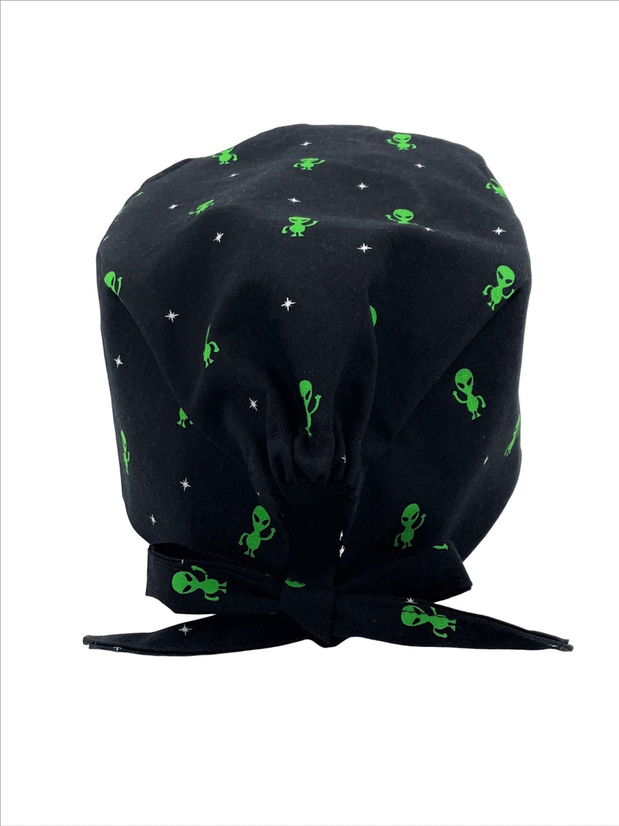Unisex scrub cap hat with green aliens waving on black cotton.