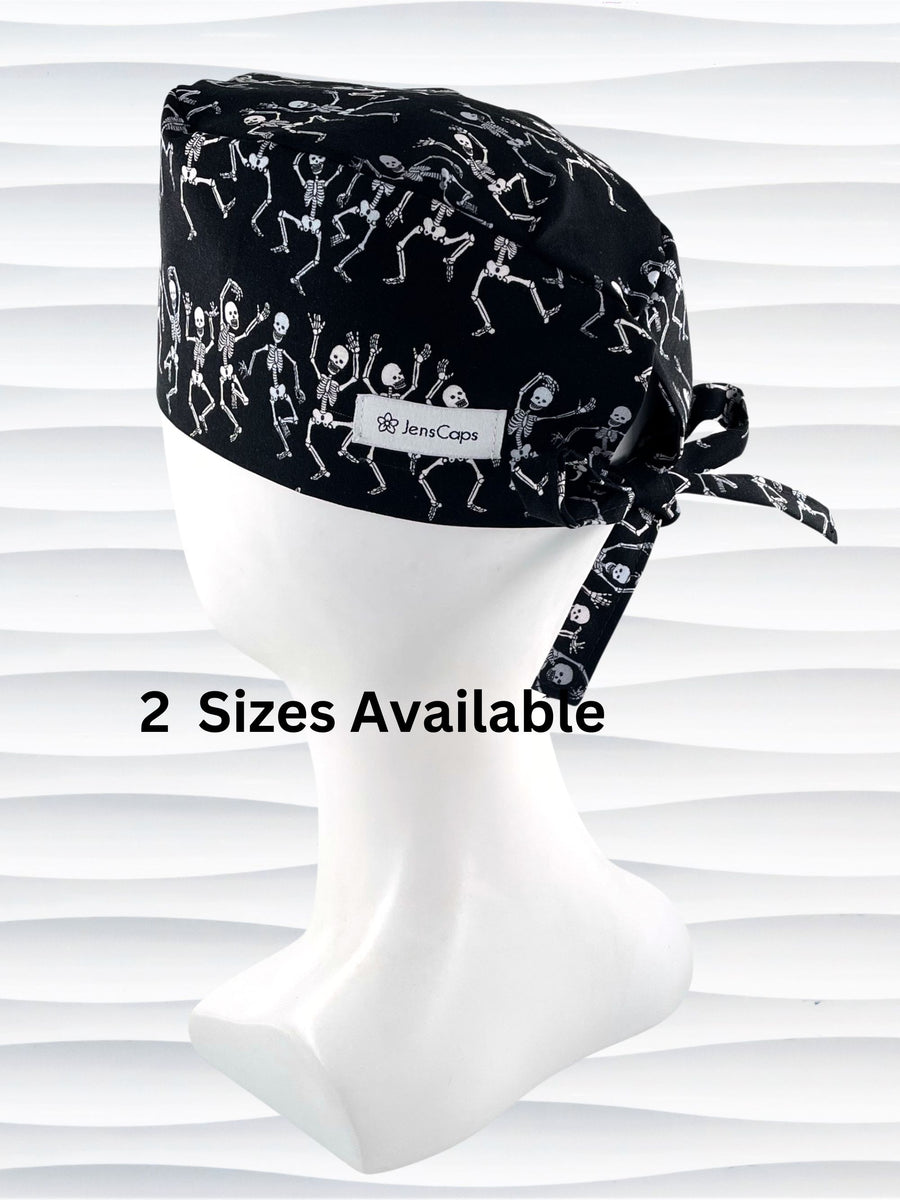Surgeon style surgical scrub cap hat with dancing skeletons in white and gray on black cotton fabric.