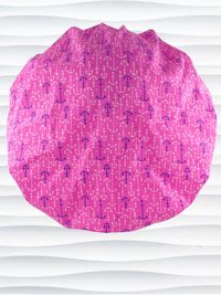 Bouffant style surgical scrub cap hat with purple and white anchors all over this pink cotton fabric