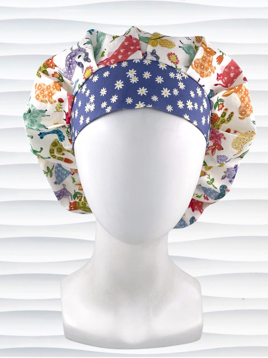 Bouffant style surgical scrub cap with cute and folksy barnyard animals, flowers, and butterflies in red, yellow, green, and blue all over white cotton fabric.