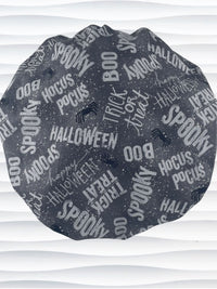 Bouffant style surgical scrub cap by JensCaps with halloween words in white and light gray and black spiders all over gray cotton fabric and displayed on a mannequin head.