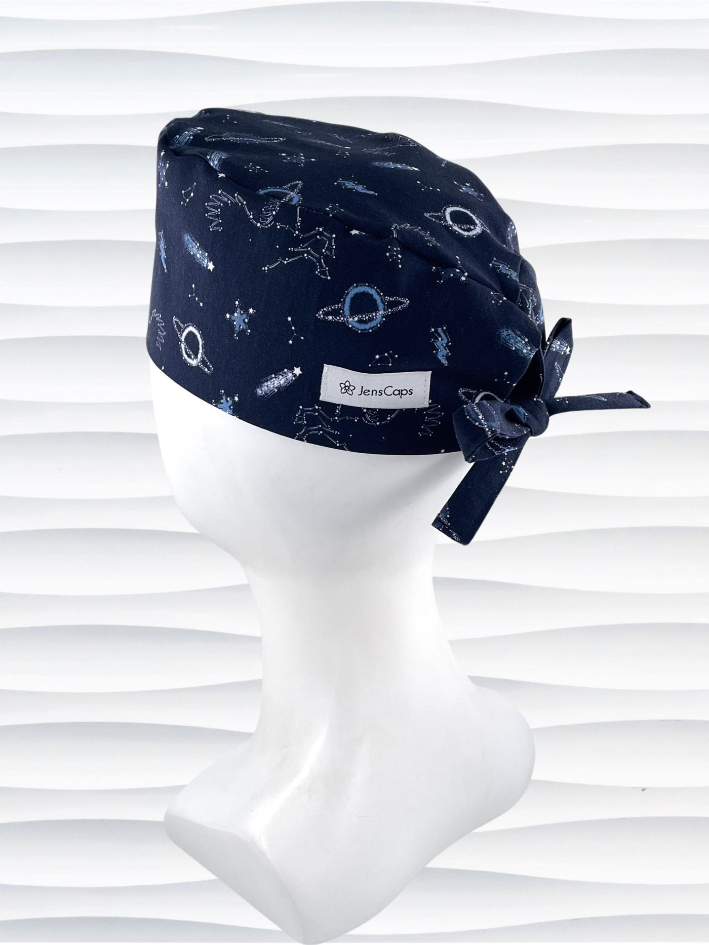 Mens Surgeon style surgical scrub cap hat with shooting stars, planets, constellations, and Pegasus in white and light blue on a dark blue cotton fabric.