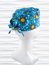 Mens surgeon style surgical scrub cap hat with blue skies, yellow suns and moons, and white stars and clouds all over blue cotton fabric