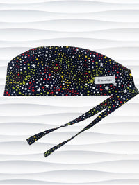 Mens surgeon style scrub cap hat with red, green, and yellow stars and white dots all over black cotton fabric.