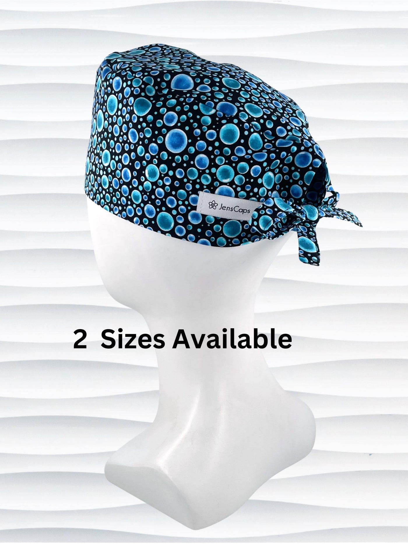 Mens surgeon style surgical scrub cap hat with blue bubbles all over black cotton fabric.