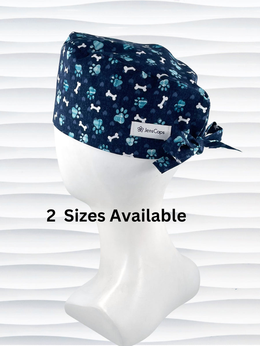 Mens Surgeon style scrub cap hat with white dog bones, blue dog paws, and blue hearts on dark blue cotton fabric.