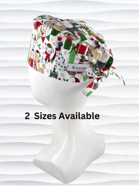 Mens surgeon style surgical scrub cap hat with dogs in scarves and santa hats in red, green, and white next to snowflakes and christmas presents on white cotton fabric.