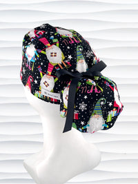 Ponytail style surgical scrub cap hat with christmas gnomes, stars, confetti, and gifts in bright colors on black cotton fabric.