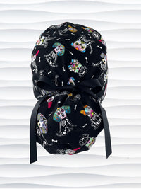 Euro Pony style surgical scrub cap hat for long hair with sugar skull dogs in bright colors on black cotton fabric.