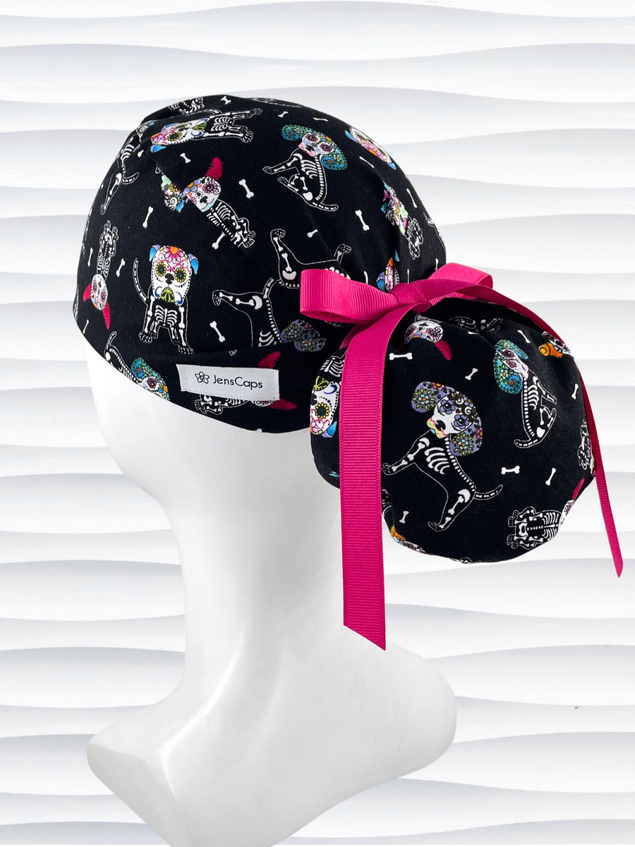 Euro Pony style surgical scrub cap hat for long hair with sugar skull dogs in bright colors on black cotton fabric.