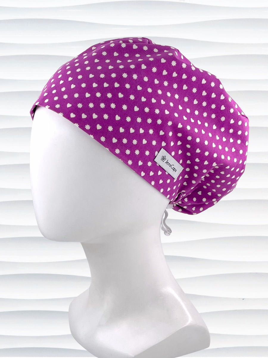 Euro Pixie style surgical scrub cap with small white hearts and daisies all over purple cotton fabric