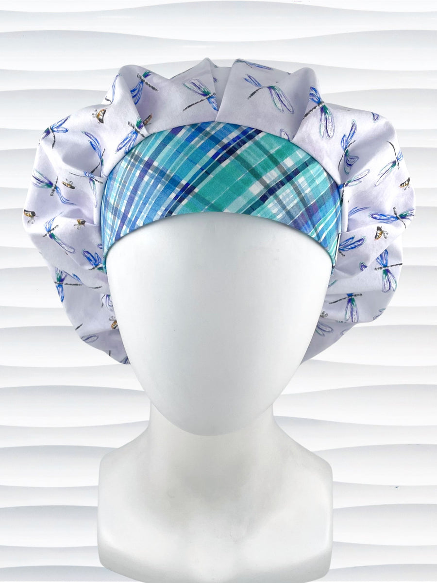 Bouffant style surgical scrub cap hat with blue dragonflies and honey bees all over lavender background cotton fabric and with a plaid front fabric