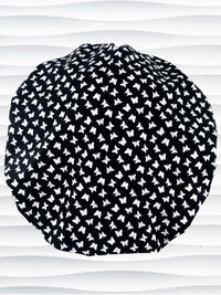 Bouffant surgical scrub cap by JensCaps with white butterflies all over black cotton fabric 