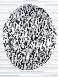 Euro style ponytail surgical scrub cap by JensCaps with a black and white zebra or snow tiger animal print on cotton fabric, finished with a grosgrain ribbon tie., and displayed on a white mannequin head.