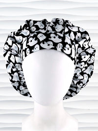 Bouffant style surgical scrub cap with white animated ghosts all over this black cotton fabric.