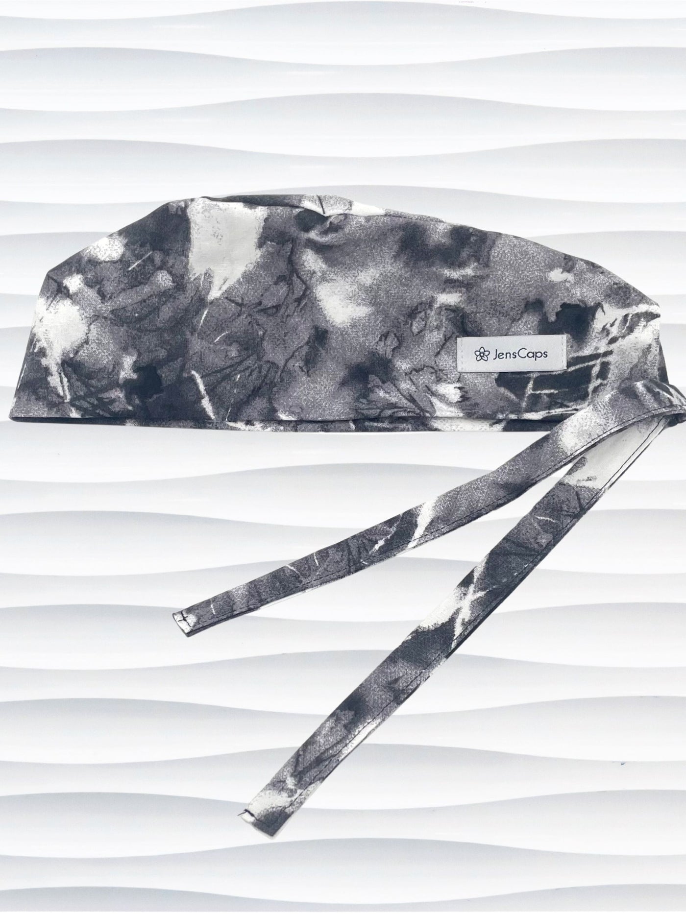 Mens surgeon style surgical scrub cap in an abstract print in black and white on cotton fabric.