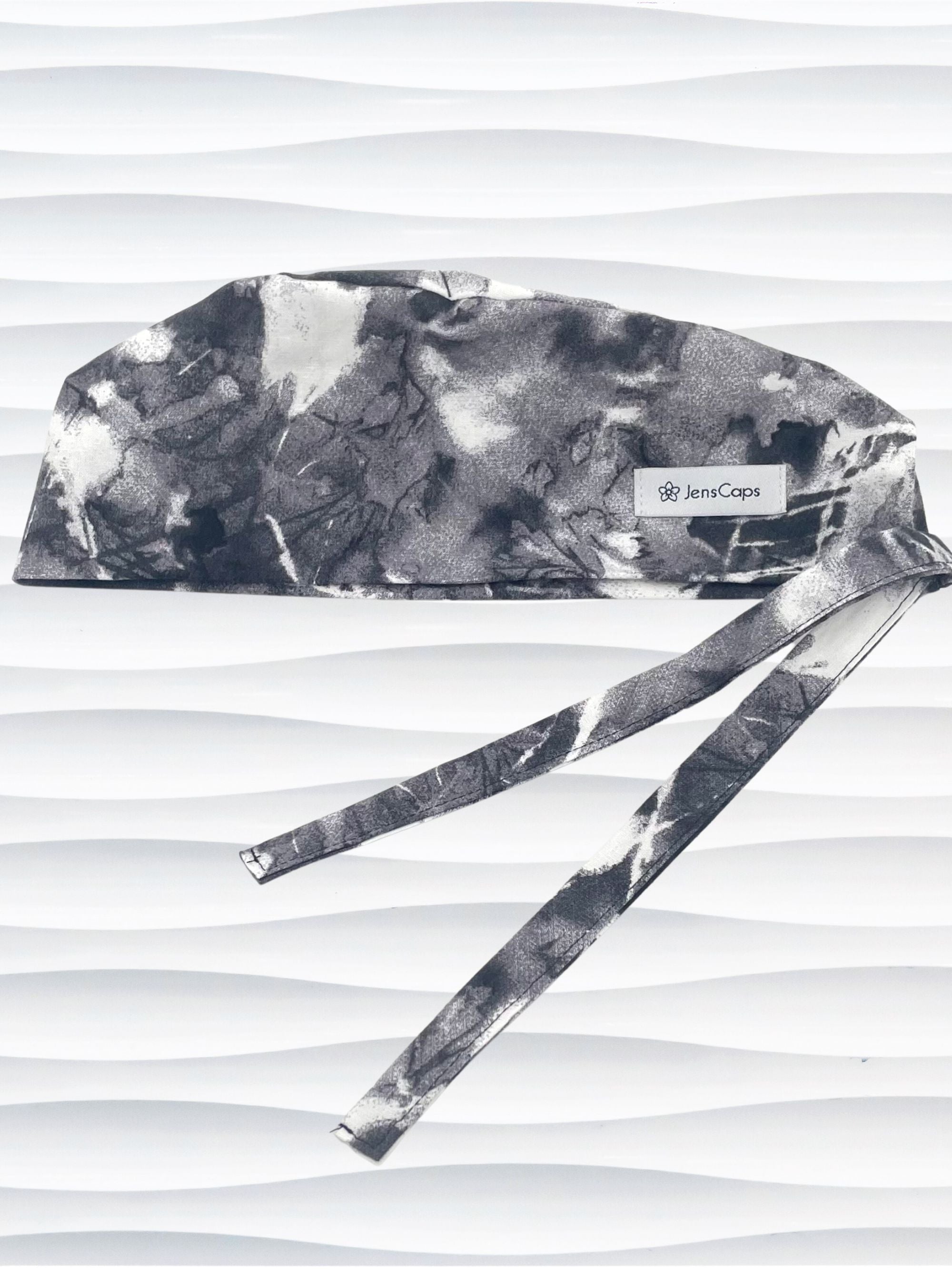 Mens surgeon style surgical scrub cap in an abstract print in black and white on cotton fabric.