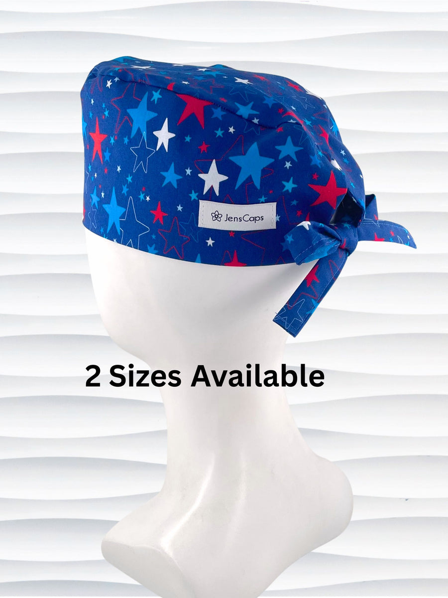 Surgeon style unixex surgical scrub cap with red, white, and blue stars all over blue cotton fabric.