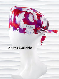 Surgeon style surgical scrub cap by JensCaps with white sheet ghosts tossed all aver an ombre red and purple cotton fabric.