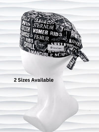 Anatomy-themed surgical scrub cap for medical professionals, featuring detailed white illustrations of the human skeleton with labeled bones like skull, mandible, and tibia on a black background