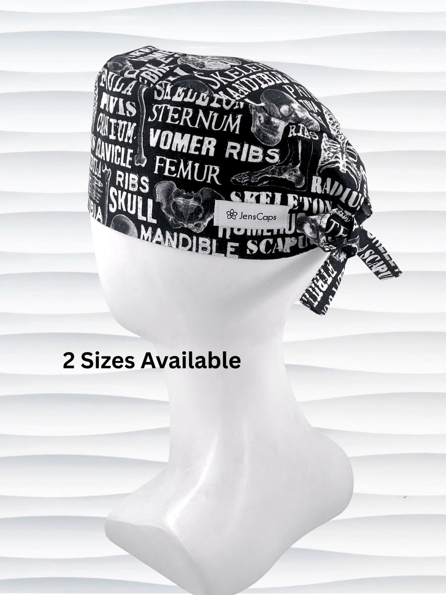 Anatomy-themed surgical scrub cap for medical professionals, featuring detailed white illustrations of the human skeleton with labeled bones like skull, mandible, and tibia on a black background