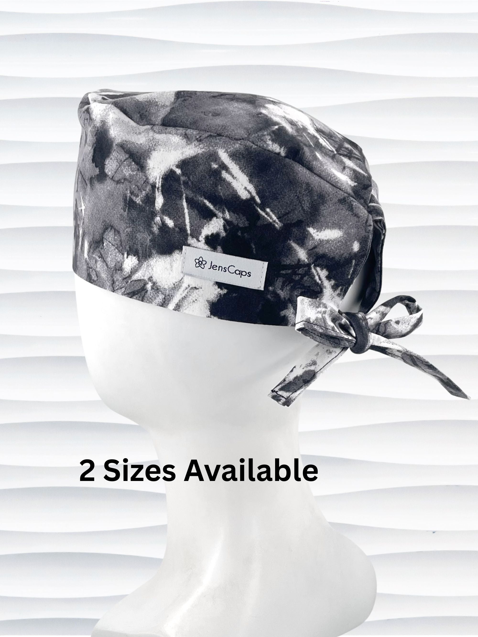 Mens surgeon tie back style surgical scrub cap in an abstract print in black and white on cotton fabric.