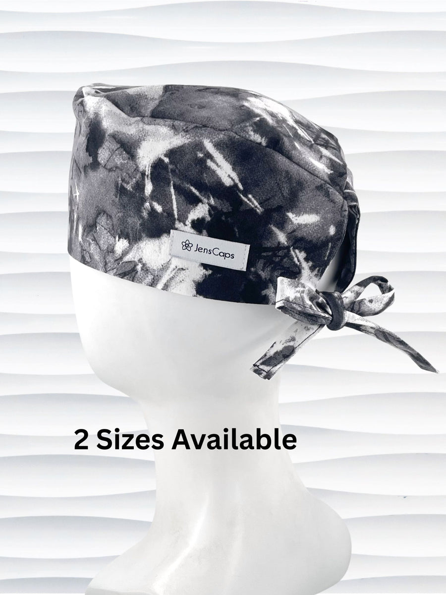 Mens surgeon tie back style surgical scrub cap in an abstract print in black and white on cotton fabric.