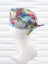 Tie-back surgical scrub cap by JensCaps with an abstract marbled swirl print in blue, magenta, yellow, and green and displayed on a white mannequin head.