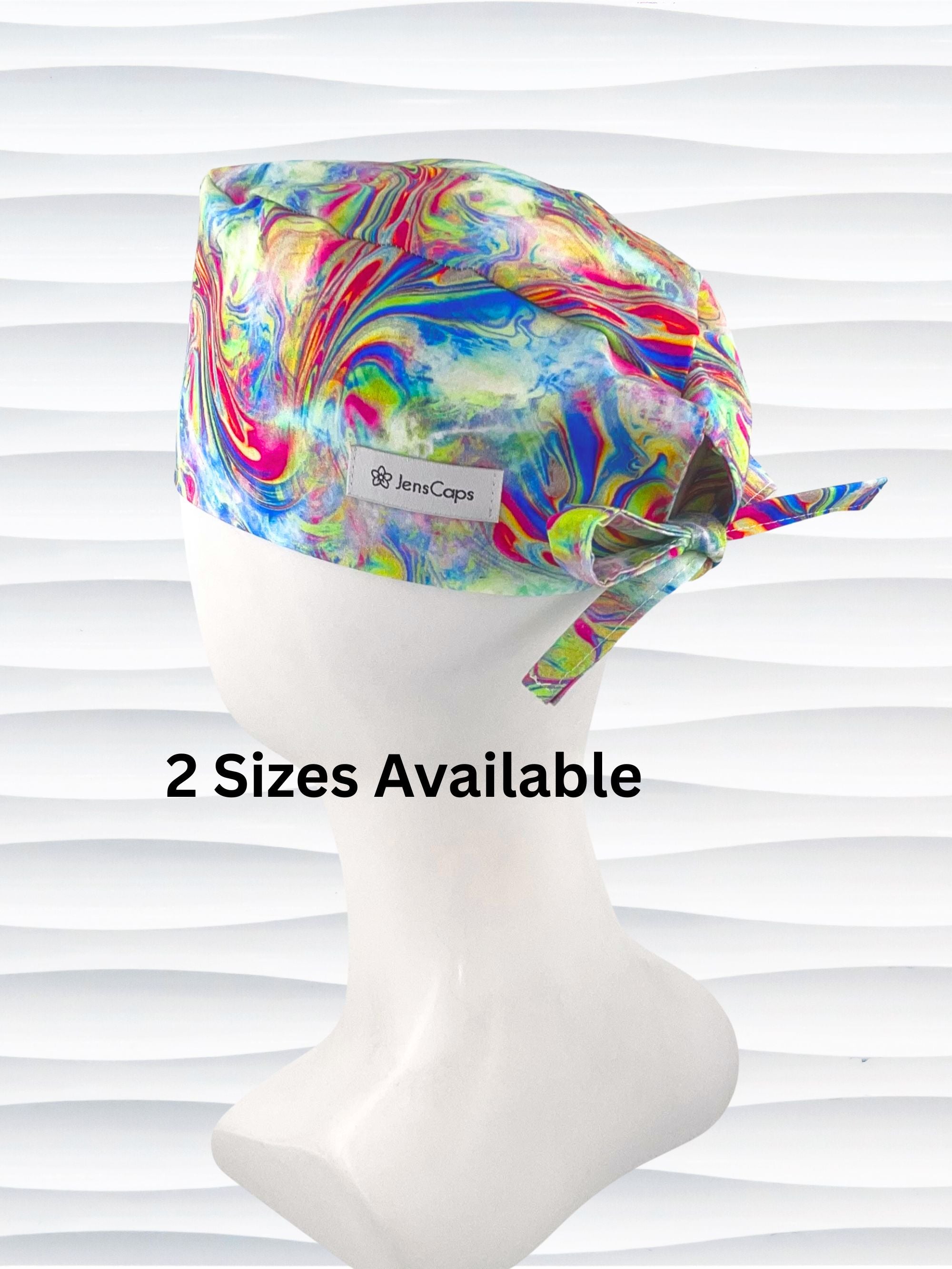Tie-back surgical scrub cap by JensCaps with an abstract marbled swirl print in blue, magenta, yellow, and green and displayed on a white mannequin head.