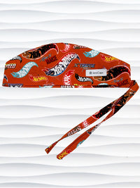 Surgeon style surgical scrub cap by JensCaps with dynamic car logos and flame details on an orange background 