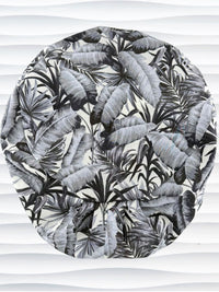 Euro Pixie style surgial scrub cap by JensCaps with black and white palm trees and banana palm leaves displayed on a mannequin head