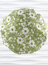 Bouffant style surgical scrub cap by JensCaps with white daisies and flowers all over a light green background cotton fabric and displayed on a mannequin head.