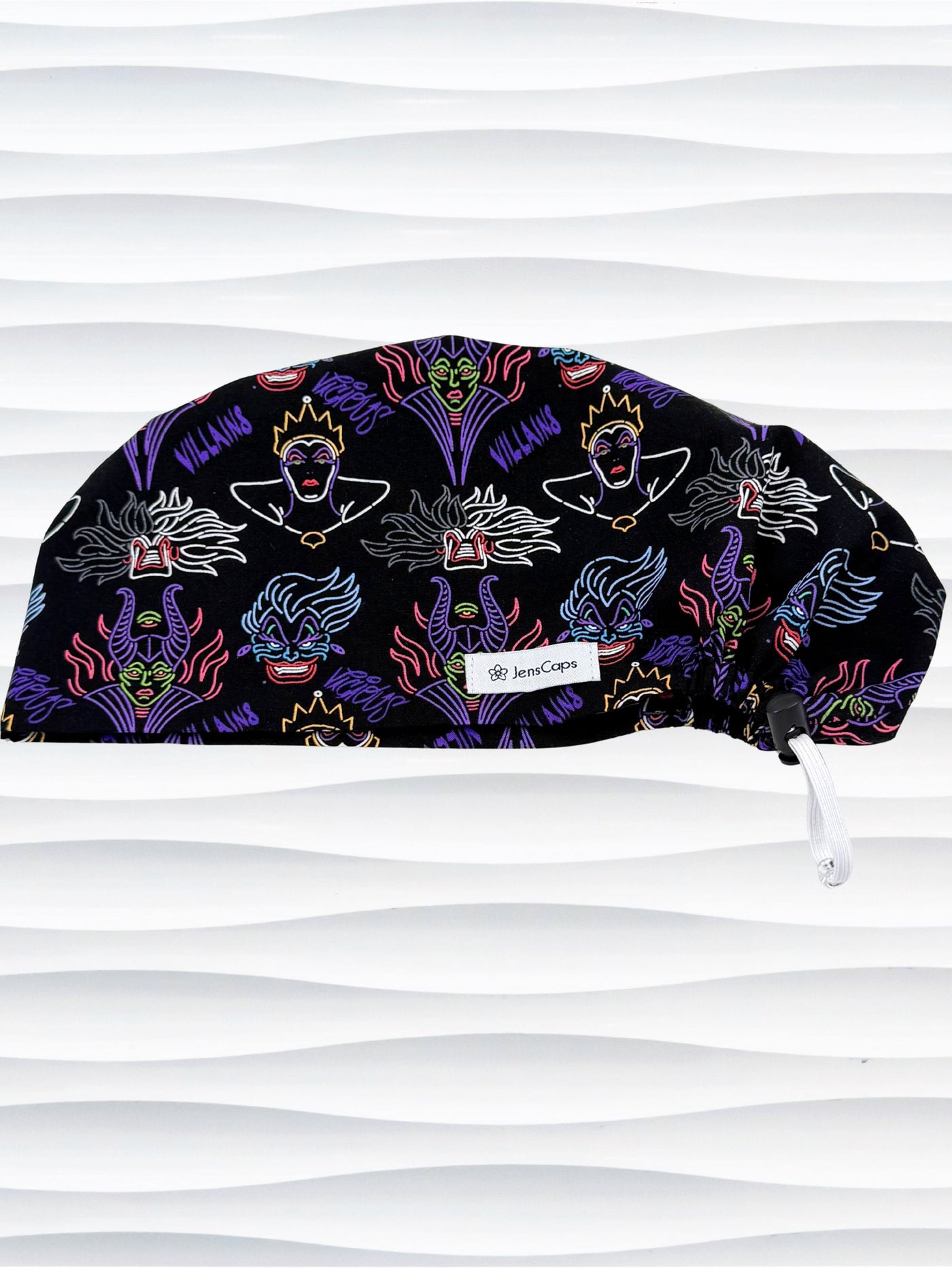 Euro Pixie style surgical scrub cap by JensCaps with neon colors of iconic villains all over black cotton fabric