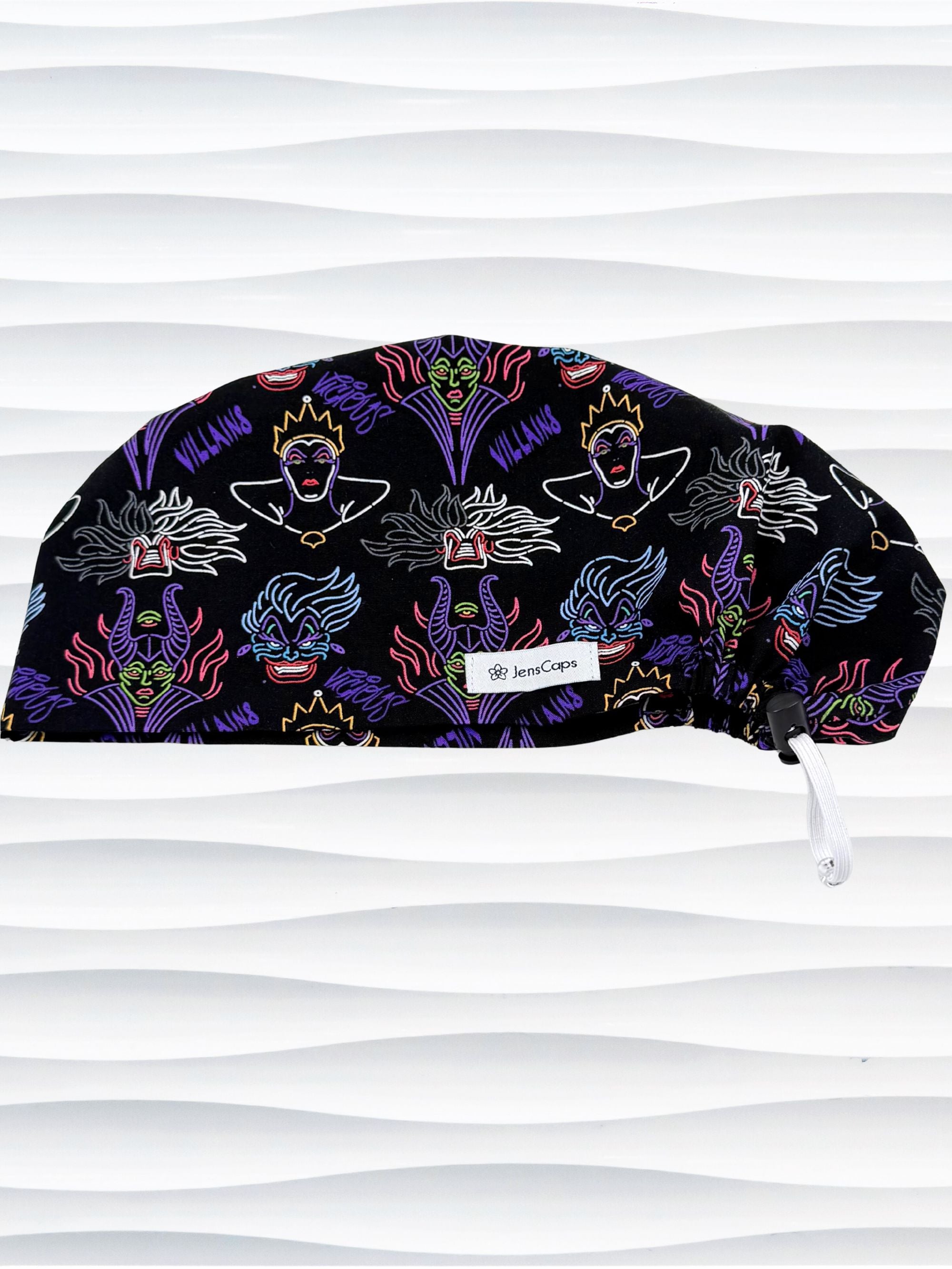 Euro Pixie style surgical scrub cap by JensCaps with neon colors of iconic villains all over black cotton fabric