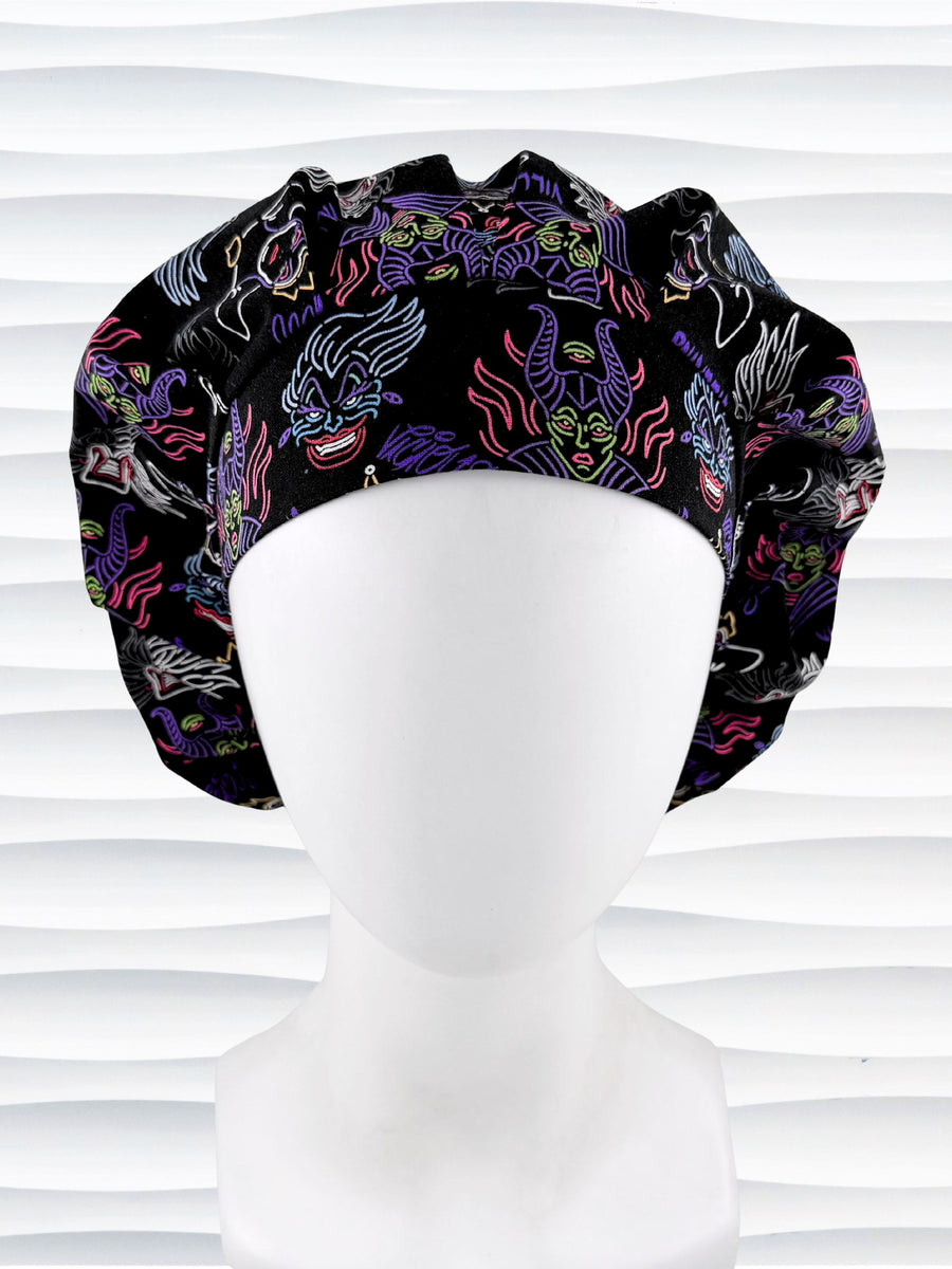 Bouffant style surgical scrub cap with neon colors of iconic villains all over black cotton fabric and displayed on mannequin head.