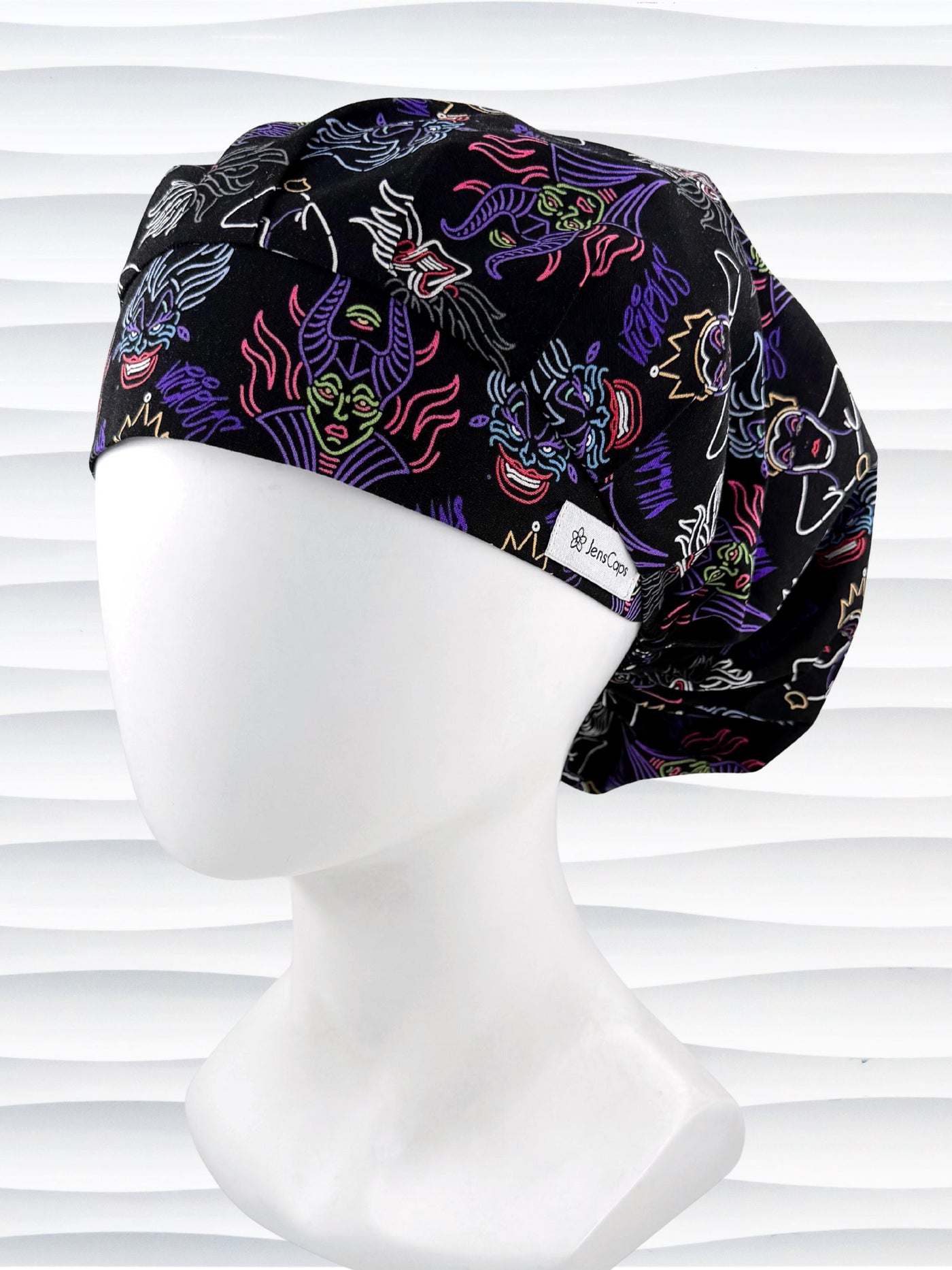 Bouffant style surgical scrub cap with neon colors of iconic villains all over black cotton fabric and displayed on mannequin head.