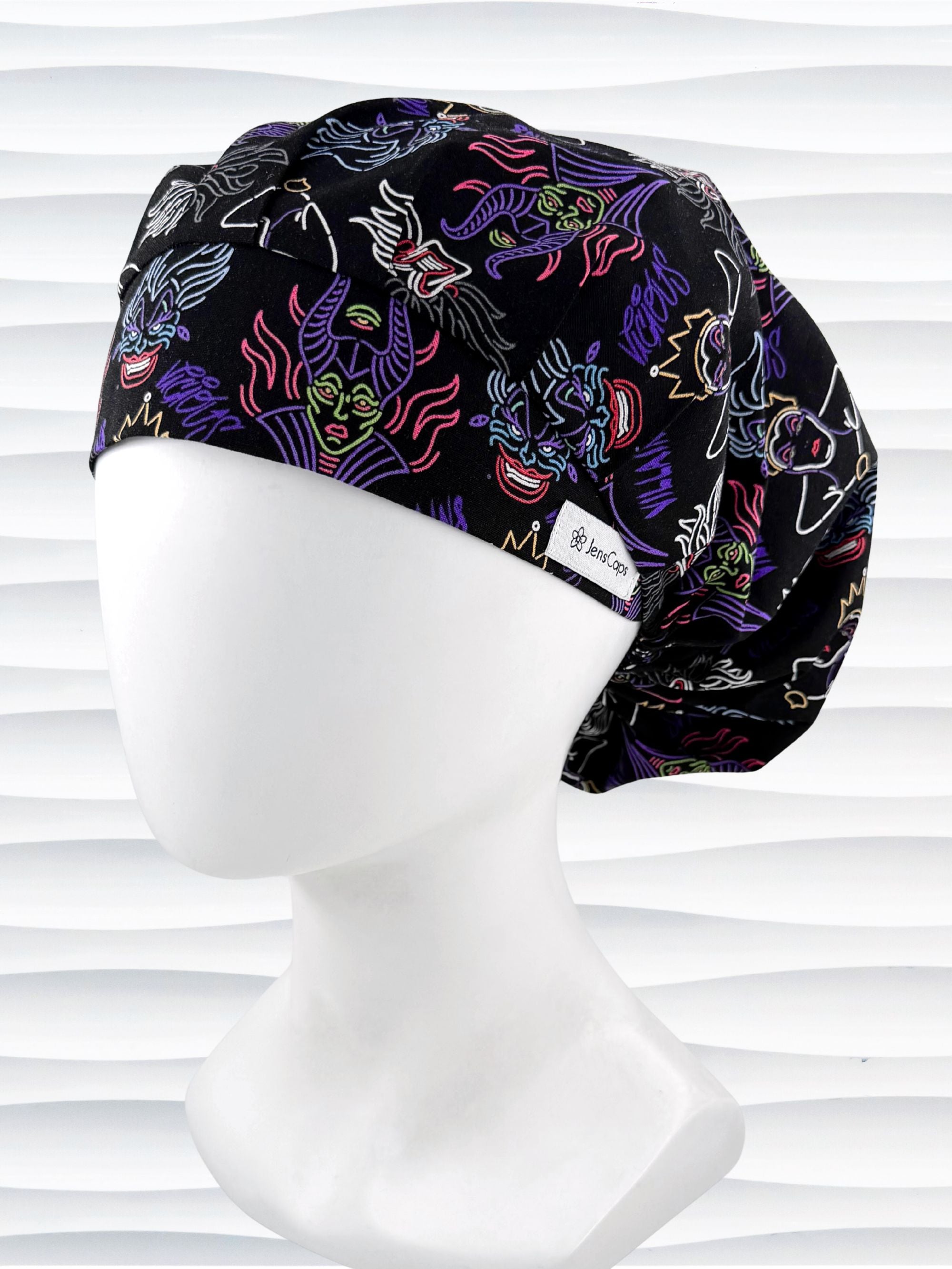 Bouffant style surgical scrub cap with neon colors of iconic villains all over black cotton fabric and displayed on mannequin head.