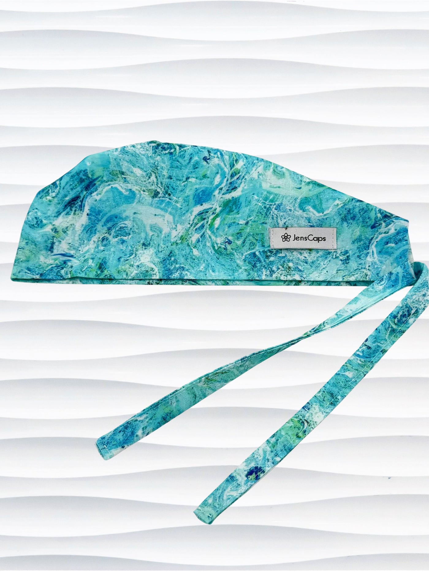 Turquoise and white marble abstract mens surgical scrub cap by JensCaps displayed on mannequin head