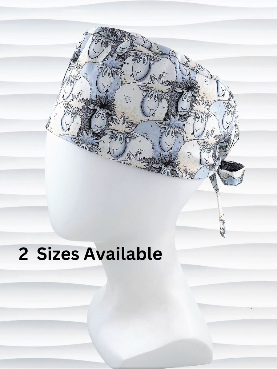 Surgeon style surgical scrub cap hat with a cute herd of cartoon sheep in blues and white on cotton fabric.