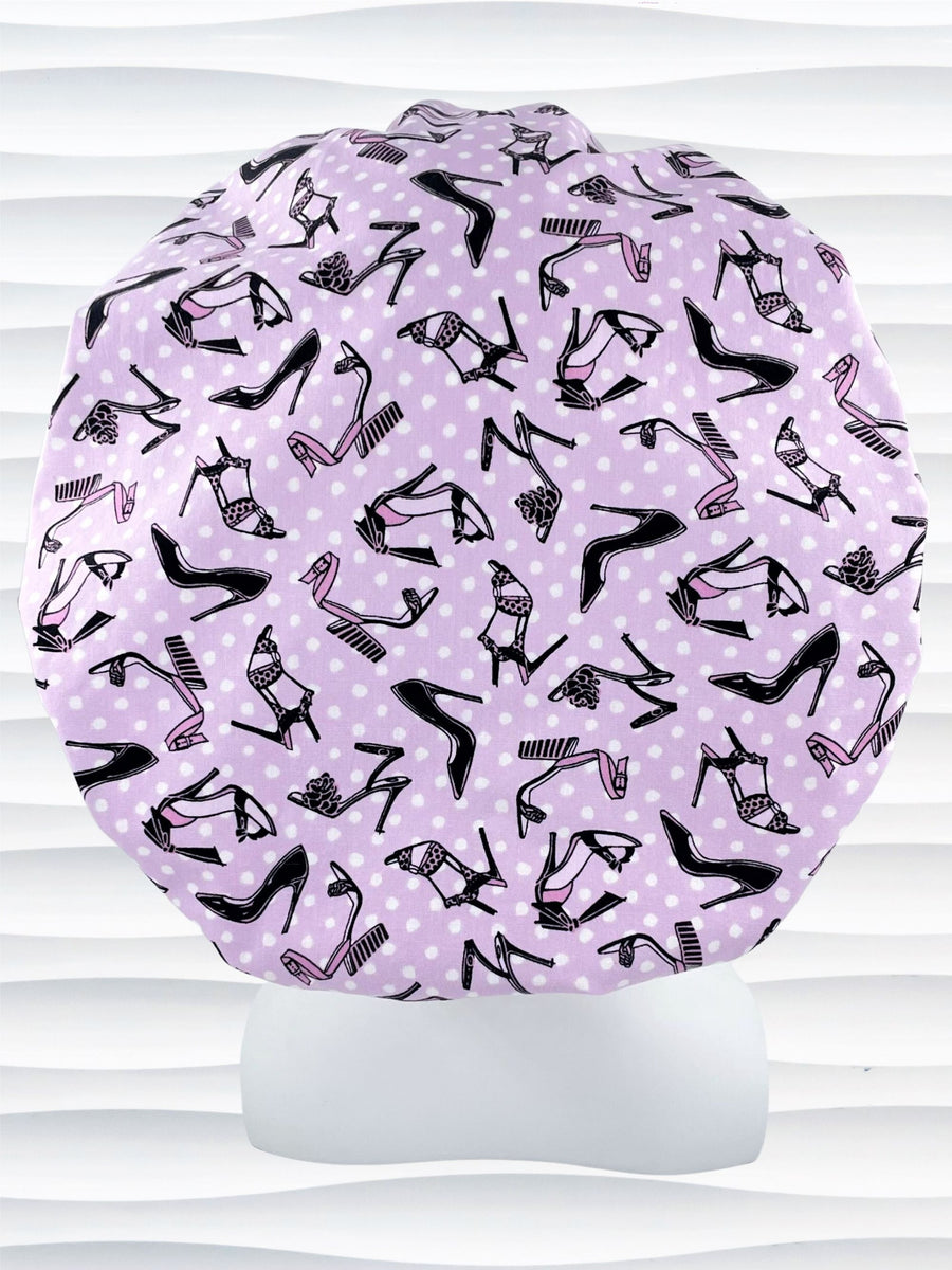 Bouffant style scrub cap hat with pink and black high heel shoes and white dots on pink cotton fabric.