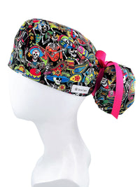 Ponytail scrub cap hat with day of the dead in bright colors on black cotton fabric and finished with grosgrain ribbon ties.