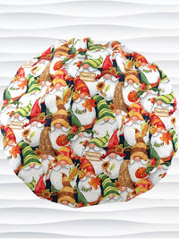 Bouffant style surgical scrub cap with gnomes in fall colors holding sunflowers and signs that say thankful and displayed on a mannequin head.