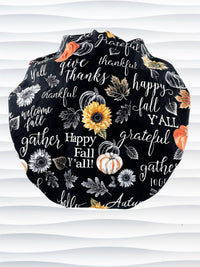 Bouffant style surgical scrub cap hat with pumpkins, sunflowers, and words about Thanksgiving on black cotton fabric. Happy Fall Y'all
