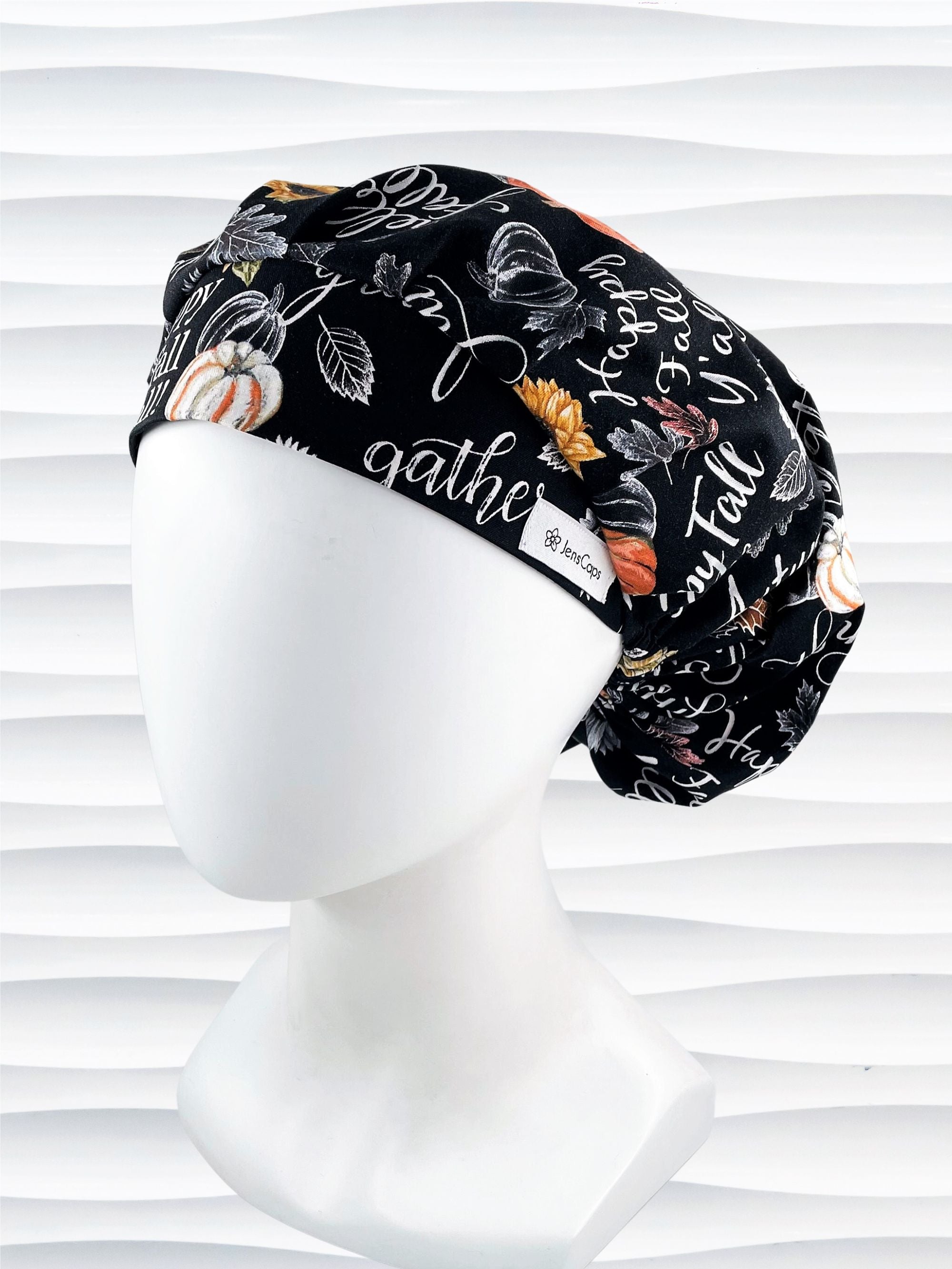 Bouffant style surgical scrub cap hat with pumpkins, sunflowers, and words about Thanksgiving on black cotton fabric. Happy Fall Y'all
